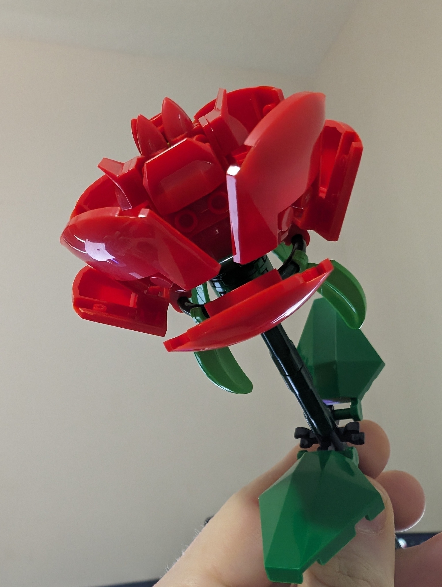 Photo of a red rose built with an interlocking brick system.