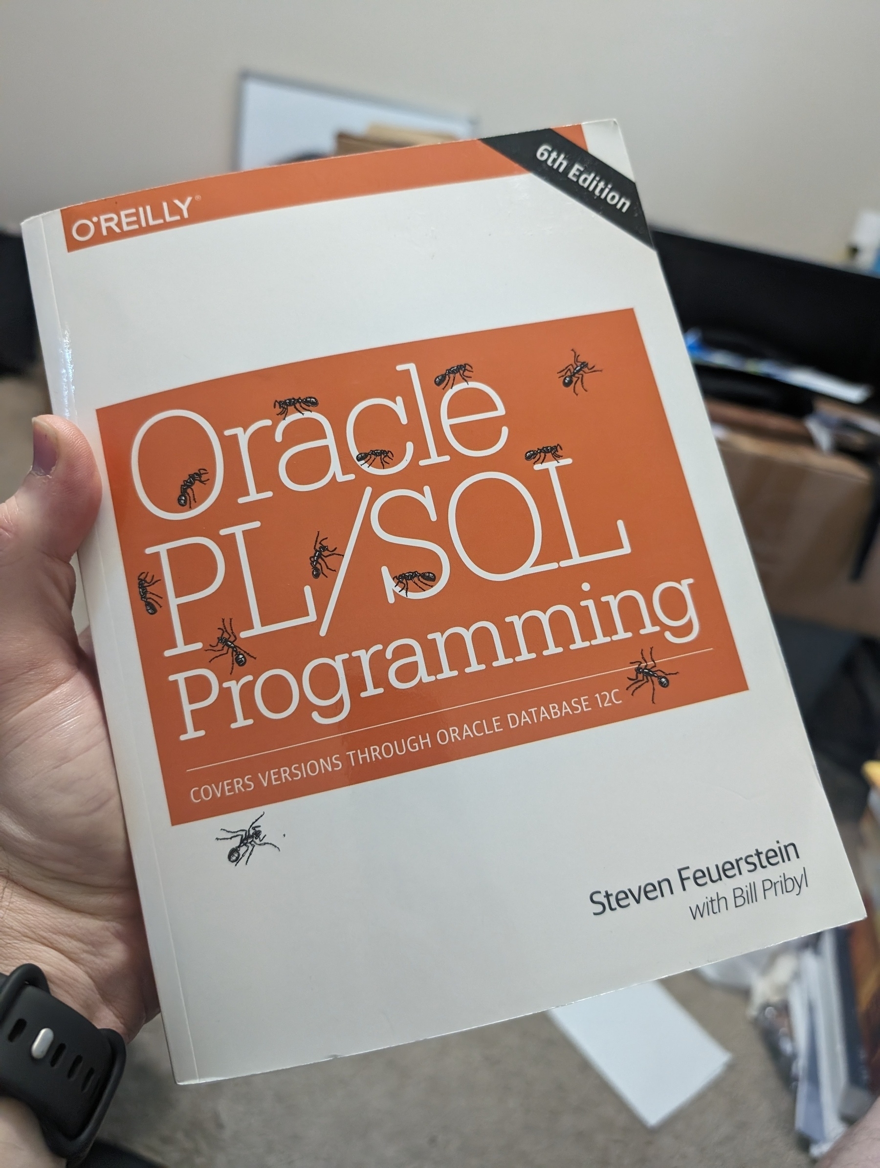 Photo of book: Oracle PL/SQL Programming, sixth edition, by Steven Feuerstein with Bill Pribyl. From O'Reilly books.
